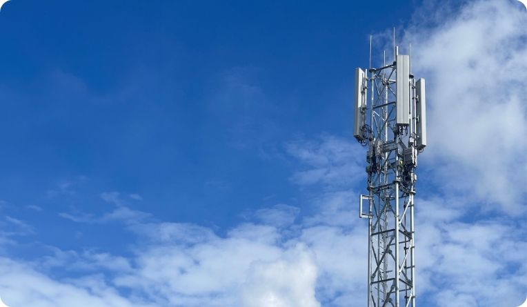 Telecoms tower against a clear blue sky