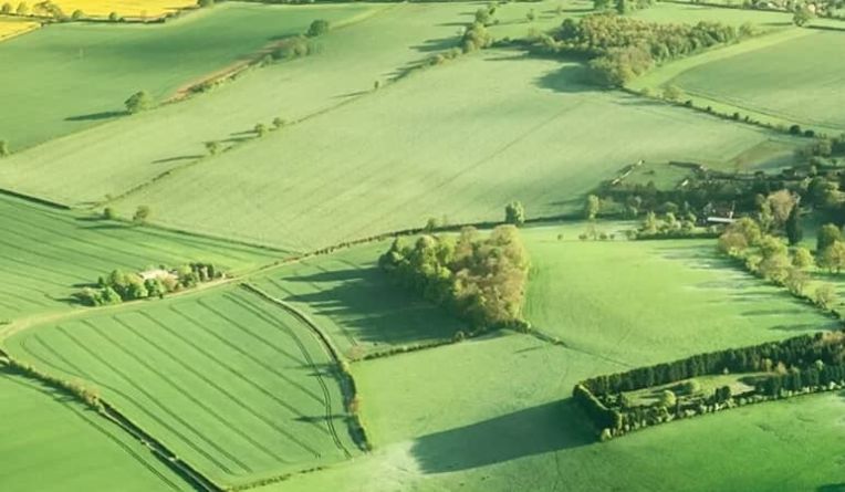 Telecoms tower next to a tennis court